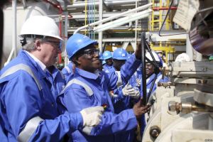 John Atta Mills, former president of Ghana, turns on a valve at the Jubilee offshore oil fields.